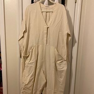 Oversize white jumpsuit with pockets and belt